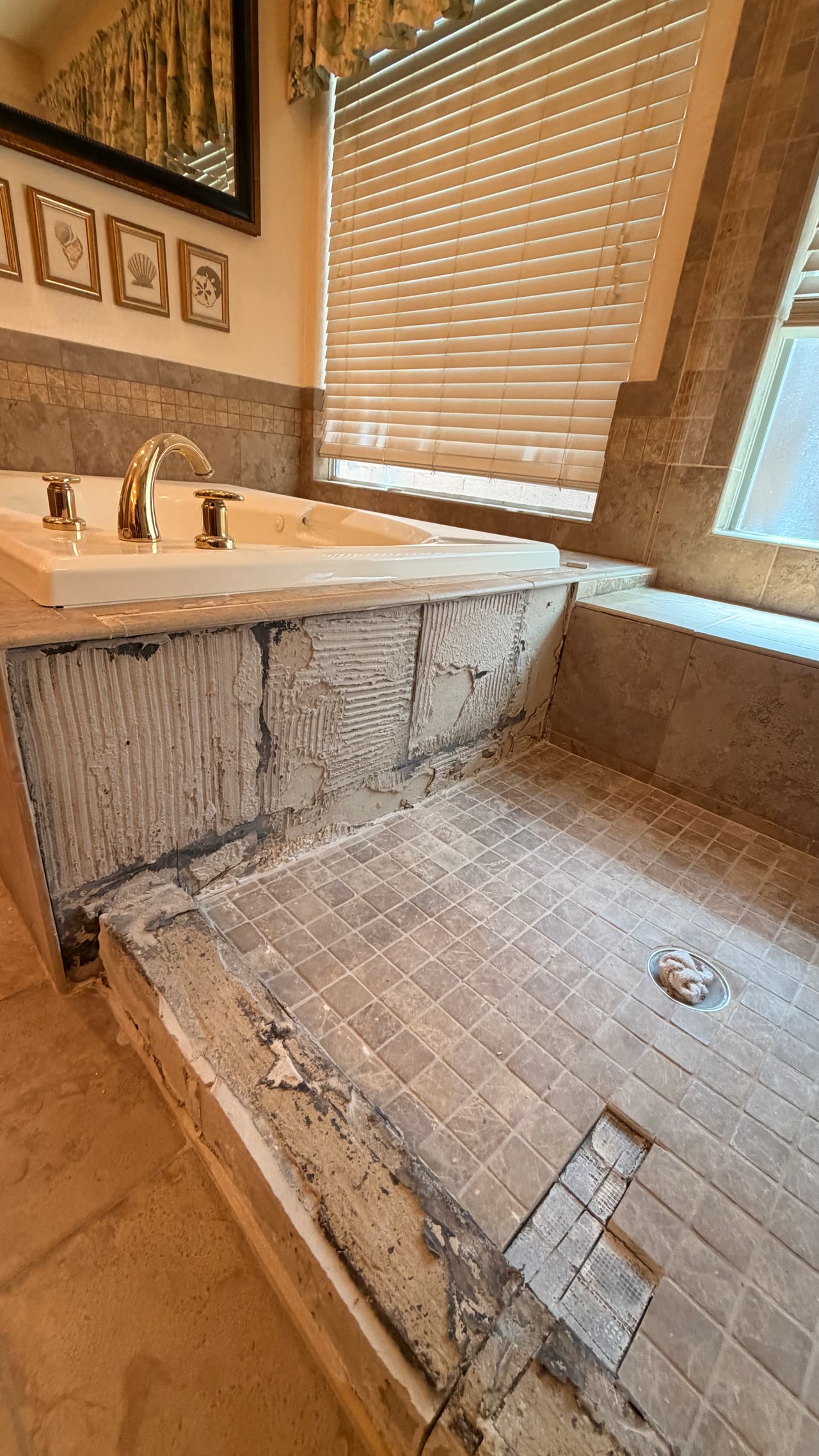 Bathroom tile demolition in progress